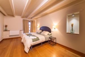 Postel nebo postele na pokoji v ubytování La Casa de la Vieja Bodega