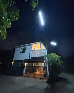 a building with a light on top of it at night at D sleep Home Chiangmai in Chiang Mai
