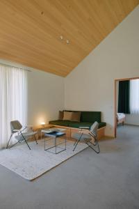 a living room with a couch and two chairs and a table at Haus Aerli in Ehrwald