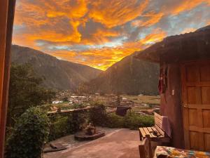 a view of a sunset from the balcony of a house at Sevawasi in Cusco