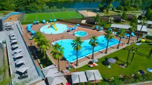 an overhead view of a water park with two pools at Campofelice Camping Village in Tenero