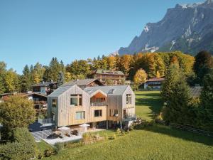 an image of a house in the mountains at Haus Aerli in Ehrwald