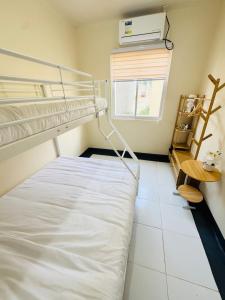 Postel nebo postele na pokoji v ubytování Sky's Travelers Inn Near Dahilayan & Del Monte