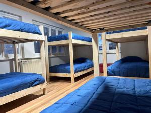 Giường trong phòng chung tại Casa Martin Pescador