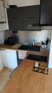 a kitchen with a wooden counter top in a room at Maison Brunet in Aime La Plagne