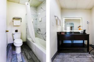 a bathroom with a toilet and a sink at Edyn Hotel By Townhouse Wytheville US 52 in Wytheville +22 photos