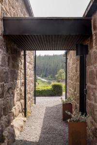 an entrance to a building with a stone wall at Fernshade Cottage By Birch Stays in Stonehaven +12 photos