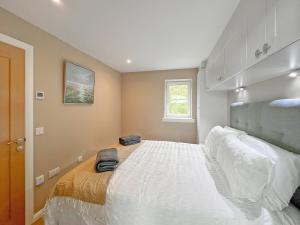 Ένα ή περισσότερα κρεβάτια σε δωμάτιο στο Grey Rocks Apartment