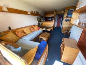 a living room with a couch and a table at Appartement Arcs 1800 Les Villards 5 personnes in Bourg-Saint-Maurice