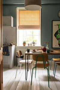 a kitchen with a table and chairs and a window at Glen Lodge And Abhainn Cottage By Birch Stays in Stonehaven