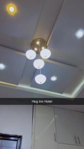 a ceiling with a bunch of lights on it at Hog Inn Hotel in Benin City