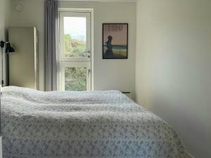 Ένα ή περισσότερα κρεβάτια σε δωμάτιο στο Holiday Home With Panoramic Views On Fanø