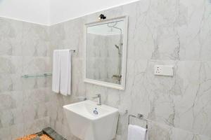 a white bathroom with a sink and a mirror at STARK Villa in Talpe +21 photos