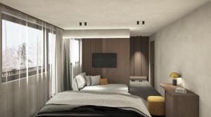 a bedroom with a bed and a large window at Hotel Hell in Ortisei
