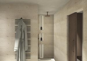 a bathroom with a towel hanging on a wall at Hotel Hell in Ortisei