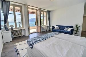 a bedroom with a large bed and a view of the ocean at La Villa in Montreux