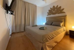 a bedroom with a large bed in a room at Apartment in 5 Mares development in Puebla de Farnals