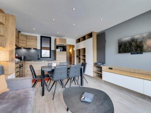 a living room and kitchen with a table and chairs at Appartement pour 4 pers à Tignes le Lac - Balcon, proche pistes et commerces - FR-1-641-120 in Tignes