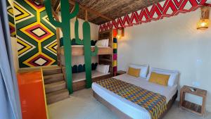 a bedroom with two bunk beds in a house at Hotel Wayira Beach by On vacation in Ríohacha +61 photos