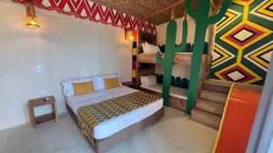 a bedroom with two bunk beds in a house at Hotel Wayira Beach by On vacation in Ríohacha