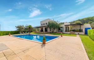 a villa with a swimming pool and a house at S'ametllerar in Artá
