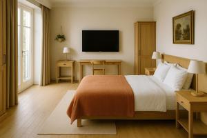 a bedroom with a bed and a flat screen tv at Aloen Weresos in Cunnamulla