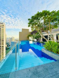 a swimming pool on the roof of a building at Majestic Residence KLCC By AFA in Kuala Lumpur
