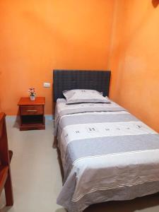 En eller flere senge i et værelse på Amazon Soul Apartment