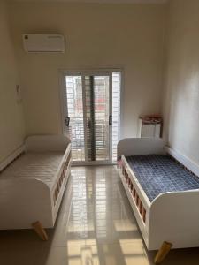 Ένα ή περισσότερα κρεβάτια σε δωμάτιο στο Petit mbao villa