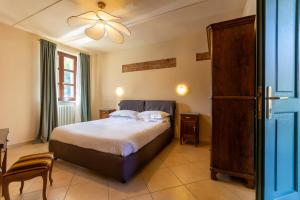 Postel nebo postele na pokoji v ubytování La Fornace - Rooms & Pool
