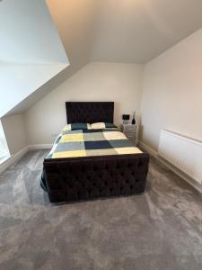 a bedroom with a large bed in a room at Birch view getaway in Dunshaughlin +14 photos