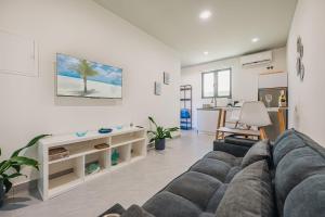 a living room with a couch and a table at Private Suite HotTub in Santa Cruz