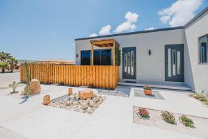 a house with a wooden fence in front of it at Private Suite HotTub in Santa Cruz