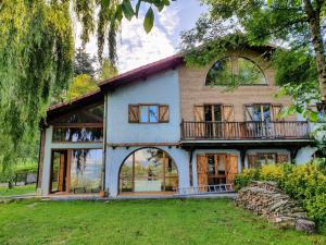 a large white house with a porch and a balcony at Villa Elorrio in Elorrio