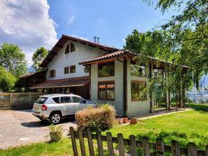 a house with a car parked in front of it at Villa Elorrio in Elorrio +12 photos