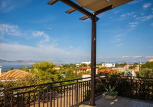 a balcony with a view of the water at Vista Mare Aegina in Kipséli