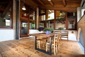 a wooden table and chairs on a patio at Il Nido della Buonanotte 1 family friendly in Verona