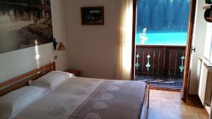 Postel nebo postele na pokoji v ubytování Albergo Meublè Victoria