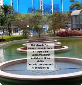 a fountain in a park with a list of cities at Flat Mina de Ouro 300m Metrô Conceição ao lado SP Expo Congonhas Direto Autódromo in Sao Paulo