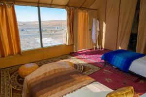 Postel nebo postele na pokoji v ubytování Luxury Desert Queen Camp