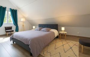 a bedroom with a large bed and a rug at Three Bedroom Lovely Home In Joganville in Joganville