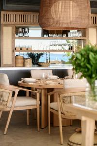a dining room with a wooden table and chairs at Nalu Villa in Cape Town +25 photos