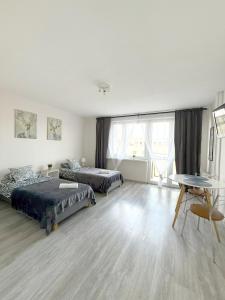 En eller flere senge i et værelse på 03 Gdynia Centrum - Apartament Mieszkanie dla 2 os