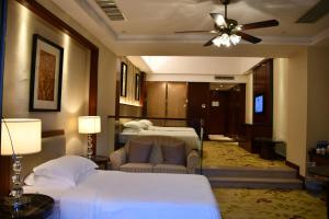 Ένα ή περισσότερα κρεβάτια σε δωμάτιο στο Country Garden An'an Residence