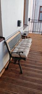 a bench sitting on top of a deck at Rembrandt Hostel in Kraków