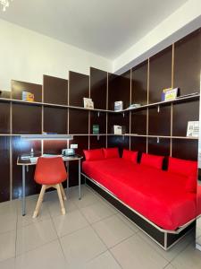 a room with a red bed and a red chair at apartment11 in Ulm +96 photos