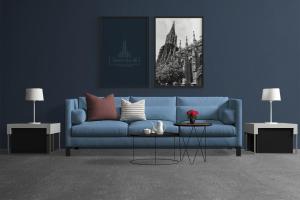 a blue couch in a living room with two tables at apartment11 in Ulm