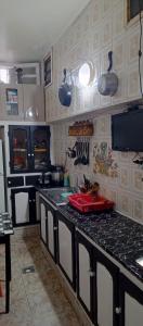 Η κουζίνα ή μικρή κουζίνα στο Chambre privée avec terrasse