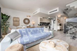 a living room with a bed and a kitchen at Golden View 2460 in Manilva