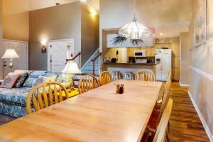 a dining room and living room with a table and a kitchen at Sea Colony - 55049 Pine Lake Dr in Bethany Beach +31 photos